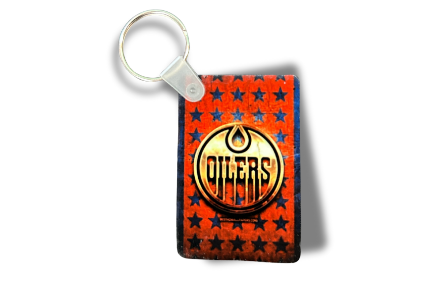 Keychain with ' Oilers' logo on a red background with blue stars