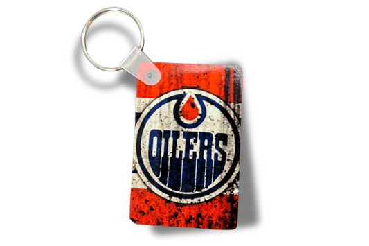 Keychain with Oilers logo on a white background